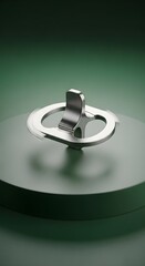 A close-up of a modern metallic security tag with a circular design and a latch mechanism, placed on a smooth surface with a gradient green background