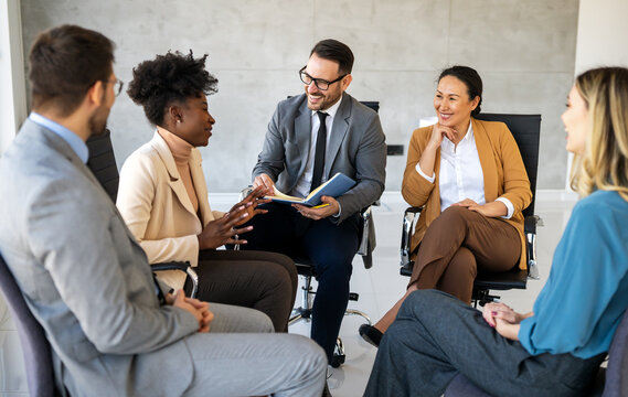 Fototapeta Business colleagues demonstrate teamwork, collaboration, communication, and strategy in office