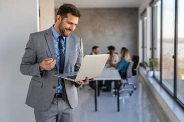 Professional in office environment, highlighting teamwork, collaboration, leadership, and innovation