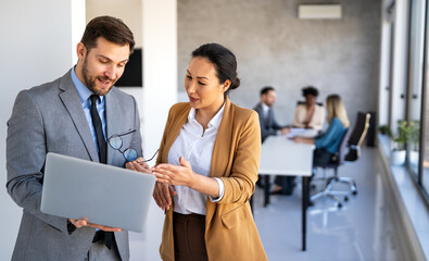 Multicultural business professionals in office, teamwork to achieve corporate success together