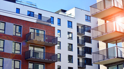 Modern luxury residential flat. Modern apartment building on a sunny day. Apartment building with a blue sky. Facade of a modern apartment building.