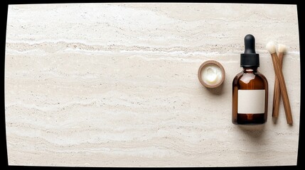 A flat lay composition featuring skincare products: an amber glass dropper bottle with a blank label, a small wooden jar filled with cream, and two wooden makeu