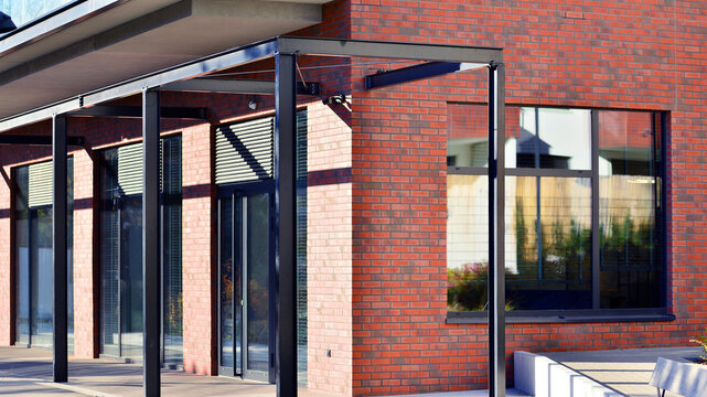 Panoramic windows of new commercial premises. Commercial property in development standard for rent. Modern housing estate.
