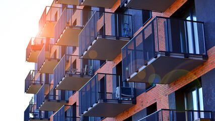 Modern luxury residential flat. Modern apartment building on a sunny day. Apartment building with a blue sky. Facade of a modern apartment building.