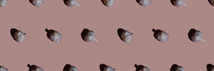 garlic seamless pattern on a pink background