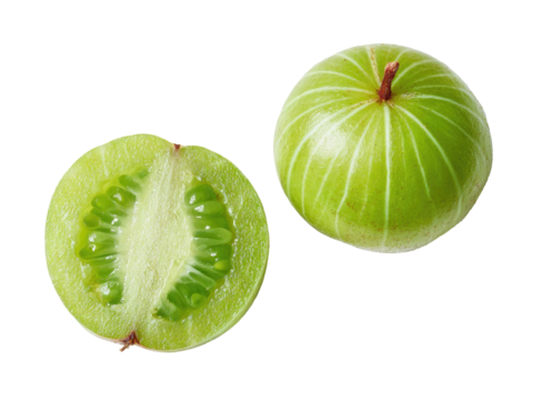A whole and halved green round fruit on a black background