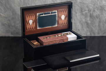 Fountain pen on a gray marble background. Boxed and unboxed. Selective focus.