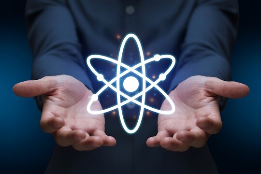 Man holding a glowing atomic structure in his outstretched hands innovation concept.