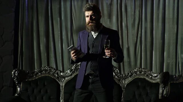 Dramatic portrait of man with money. Criminal boss with champagne and cash. Rich man in dark vintage room. Rich gangster style character. Classic film scene with man and cash. Crime boss vibe.