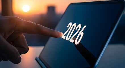 Hand Tapping '2026' on a Digital Tablet Screen, Symbolizing Future Planning, Goals, and New Beginnings Against a Sunset Cityscape