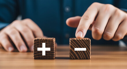 Plus or minus, finger hovering over subtraction, decision making concept now