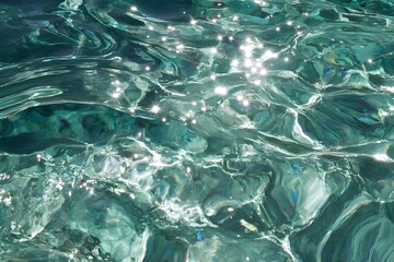 Obraz premium Aquamarine Sparkles Reflecting on Water Ripples Shimmering Abstract Fluid Surface Photography
