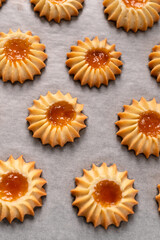 yellow cookies  flowers on a rose background