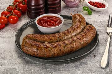 Grilled beef sausages with sauce