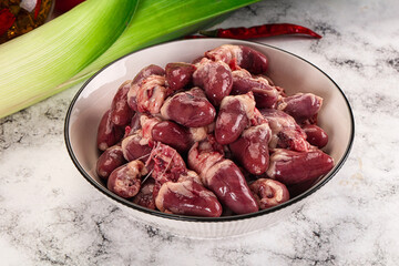 Raw chicken hearts in the bowl