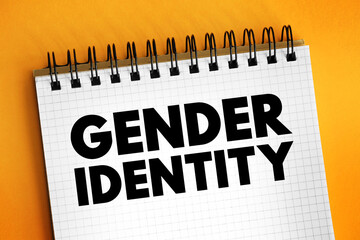 Naklejka premium Gender Identity is the personal sense of one's own gender, text concept on notepad