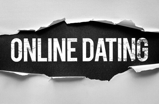 Text ONLINE DATING in bold, distressed font revealed under torn paper. Conceptual design for internet romance, dating apps, digital matchmaking, virtual relationships, and modern love connections