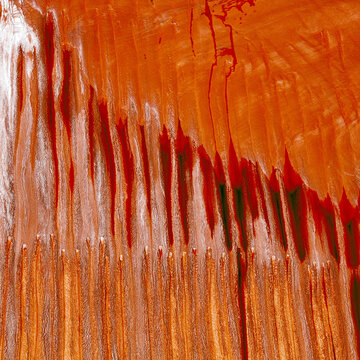 Aerial view of fiery abstract patterns cascading across the canvas, textures melding in a dance of orange and white hues, like a landscape seen from above., Boyne Island, Queensland, Australia.