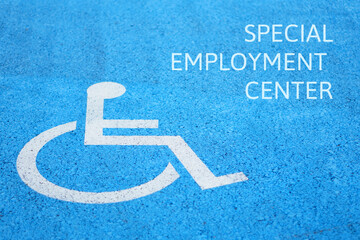 special employment center concept. words written on the asphalt next to a disability icon