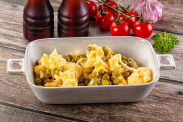 Scrambled egg omelet with green peas