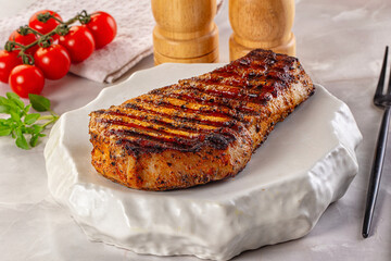 Grilled pork steak with bone