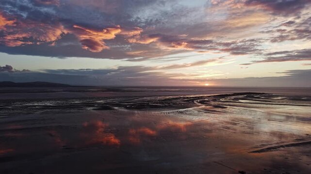 Aerial view of  the sunset reflected on the sand at Hilbre Island, West Kirby, Wirral, England