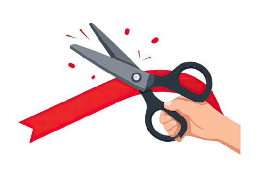 A hand holds gray scissors, cutting a red ribbon with small confetti bits flying