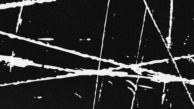 Abstract Grunge Scribble Loop.Seamless stop-motion loop of high-contrast white paint or ink scratches flickering on a black paper texture. Energetic, urban, and abstract.