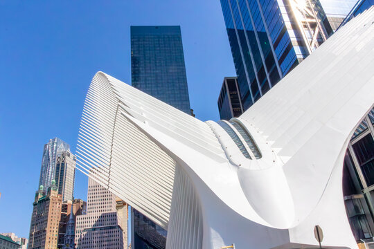 view to modern metro station Oculus at ground zero with skyscraper in background, symbolizing the power of people