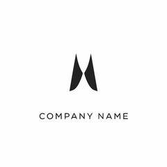 Abstract black letter M logo design on white background.