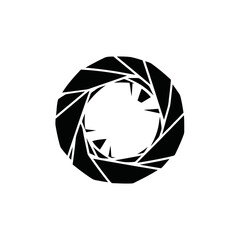 Abstract geometric aperture or iris symbol in black and white.