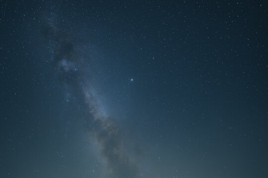 A vibrant depiction of a galactic black hole with swirling colors