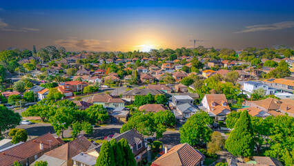 Aerial Panorama Drone View of a inner western Sydney Suburb of Ashbury Urban Sprawl and the terracotta roof tops streets and trees of Suburban Sydney  NSW Australia