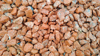 Close up of vibrant orange and red rocks creating a textured natural background