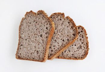 Pieces of sliced buckwheat bread on white background.