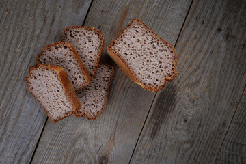 Sliced buckwheat bread on a light wooden background. Buckwheat bread with coriander.
