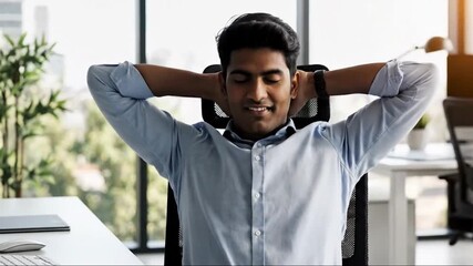 Person in office chair stretches arms, neck, back, relieved