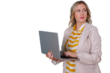 Blonde businesswoman holding laptop, typing on keyboard and looking right, analyzing data or planning for future success