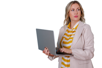 Blonde businesswoman holding laptop, typing on keyboard and looking right, analyzing data or planning for future success