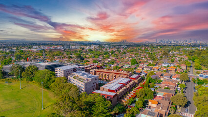 Aerial Panorama Drone View of a inner western Sydney Suburb of Ashbury Urban Sprawl and the terracotta roof tops streets and trees of Suburban Sydney  NSW Australia