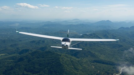 Innovative eco energy flight experience scenic mountain range aerial photography clear skies adventure concept with green energy focus