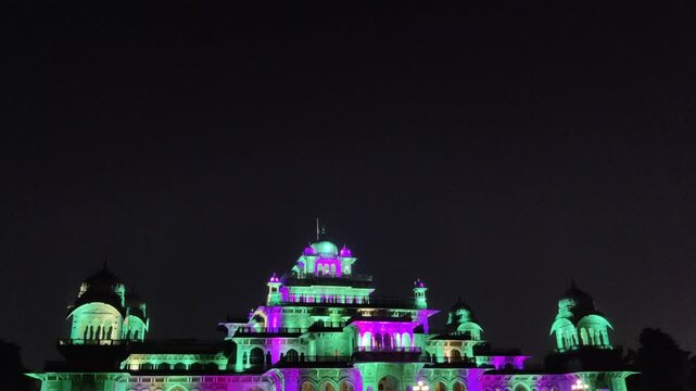 Jaipur, India 10 November 2025: Footage of Albert Hall museum at pink city Jaipur illuminated with lights at night against dark background
