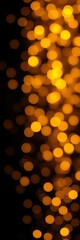 Golden bokeh sparkles on a black backdrop, perfect for festive occasions or elegant designs,  festive,  blurred lights