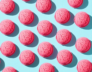 A vibrant, top-down flat lay of repeating scoops of bright pink strawberry ice cream arranged in a symmetrical pattern on a solid, bright teal background.