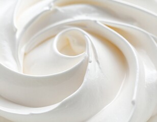 Macro photograph of a creamy, swirling white texture, resembling soft-serve ice cream or whipped cream