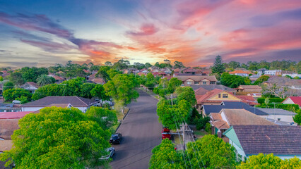 Aerial Panorama Drone View of a inner western Sydney Suburb of Ashbury Urban Sprawl and the terracotta roof tops streets and trees of Suburban Sydney  NSW Australia © Elias Bitar