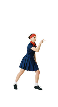 A female professional roshambo (rock-paper-scissors) player, mid-throw (paper)