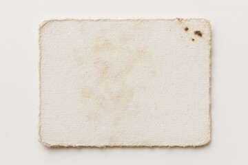 An aged photograph back shows worn paper with soft discoloration, rounded corners, and subtle texture marks, evoking a sense of timeworn history and nostalgic preservation and gentle aging.