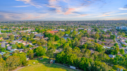 Aerial Panorama Drone View of a inner western Sydney Suburb of Ashbury Urban Sprawl and the terracotta roof tops streets and trees of Suburban Sydney  NSW Australia