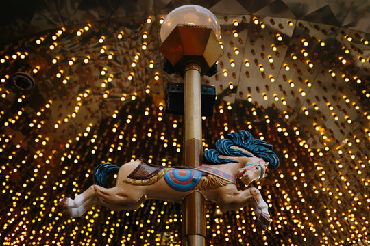 Neon-lit carousel horse with Las Vegas lights